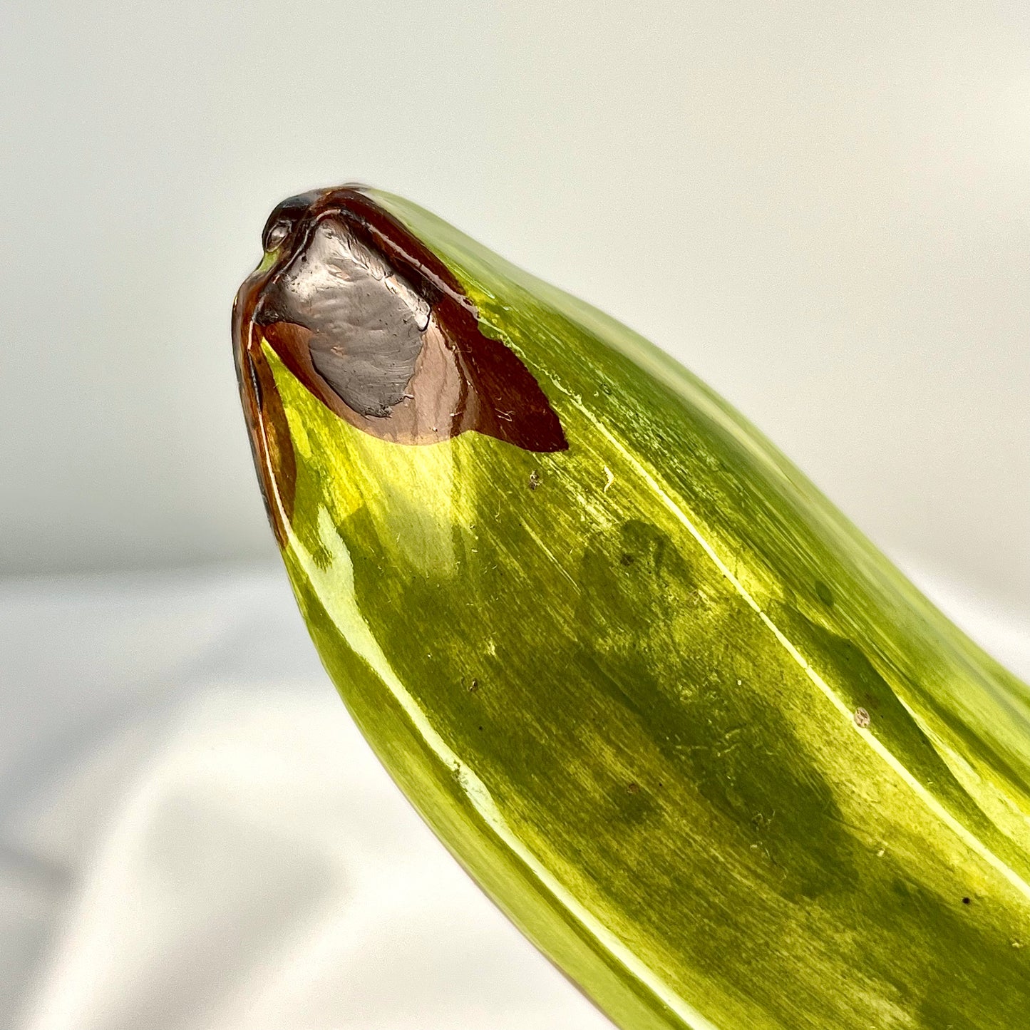 Green banana in glaze figurine